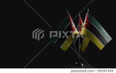 Small national flags of the Mozambique on a black background Small national flags of the Mozambique on a black background 99387449