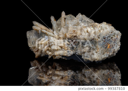 Macro mineral stone fluorite with quartz against black background Macro mineral stone fluorite with quartz against black background 99387810