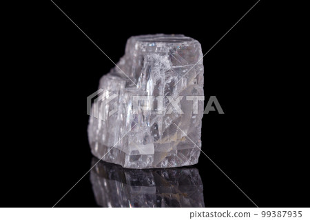 Macro mineral stone Iceland spar on black background Macro mineral stone Iceland spar on black background 99387935