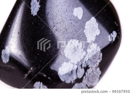 Macro mineral stone snow obsidian on white background Macro mineral stone snow obsidian on white background 99387950