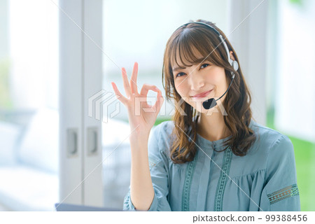 Telework operator who video chats using a computer Telework operator who video chats using a computer 99388456