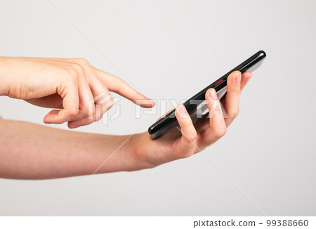 Woman hand swiping phone screen. Female receiving call, using smartphone applications, taking notes. Woman hand swiping phone screen. Female receiving call, using smartphone applications, taking notes. 99388660