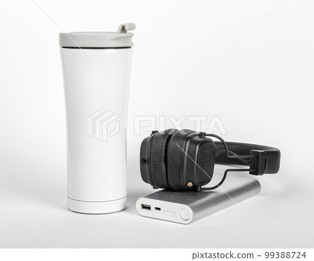 Travel stuff, thermo mug, portable charger, headphones Travel stuff, thermo mug, portable charger, headphones 99388724