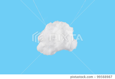 White cotton cloud hanging on strings on blue sky background. Hope, peace concept White cotton cloud hanging on strings on blue sky background. Hope, peace concept 99388987