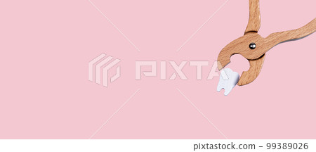 Banner with dental forceps with pulled tooth. Extraction caused by decay, gum disease, injury, impaction, overcrowded teeth. Oral health concerns concept. Copy space on pastel background 99389026
