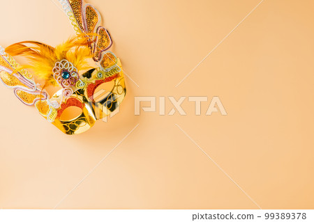 Happy Purim carnival decoration. Jewish Purim and Mardi Gras in Hebrew, celebration holiday background banner design, Golden venetian ball mask, carnival mask isolated on pastel background Happy Purim carnival decoration. Jewish Purim and Mardi Gras in Hebrew, celebration holiday background banner design, Golden venetian ball mask, carnival mask isolated on pastel background 99389378