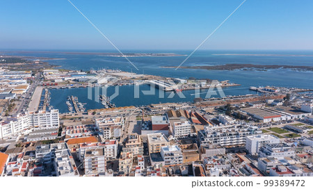 Aerial view of the Portuguese fishing tourist town of Olhao overlooking the Ria Formosa Marine Park. fishing port of fish trade Aerial view of the Portuguese fishing tourist town of Olhao overlooking the Ria Formosa Marine Park. fishing port of fish trade 99389472