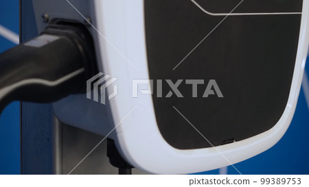 EV Charger quick charge type at car parking which DC Charging faster than AC system. EV Charger car station charging use AC socket plug for electric engine vehicle. Future transport energy technology 99389753