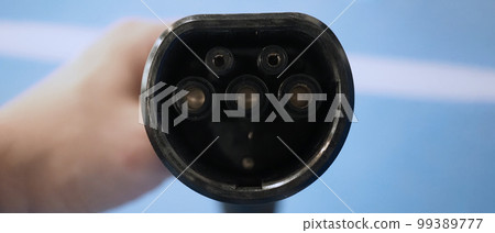 EV Charger quick charge type at car parking which DC Charging faster than AC system. EV Charger car station charging use AC socket plug for electric engine vehicle. Future transport energy technology 99389777