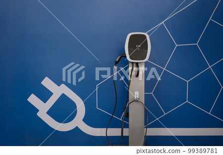 EV Charger quick charge type at car parking which DC Charging faster than AC system. EV Charger car station charging use AC socket plug for electric engine vehicle. Future transport energy technology 99389781