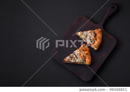 Delicious quiche with chicken, cheese, herbs, spices and herbs 99389851