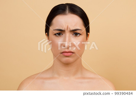 Glabellar Lines. Unhappy Young Indian Woman Frowning While Looking At Camera Glabellar Lines. Unhappy Young Indian Woman Frowning While Looking At Camera 99390484