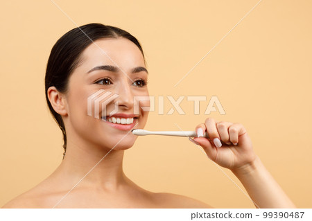 Oral Care. Closeup Portrait Of Young Indian Woman With Toothbrush In Hand Oral Care. Closeup Portrait Of Young Indian Woman With Toothbrush In Hand 99390487