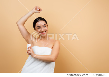 Beautiful Young Indian Female Wrapped In Towel Using Antiperspirant Stick Underarms Beautiful Young Indian Female Wrapped In Towel Using Antiperspirant Stick Underarms 99390609