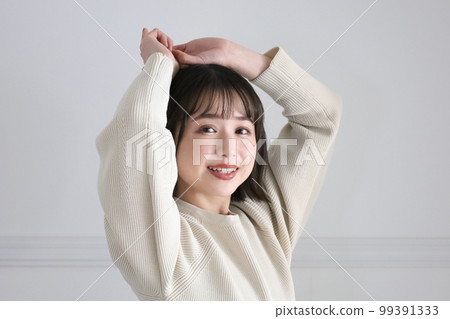 A woman looking at you with a smile 99391333