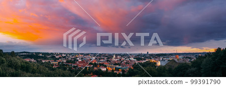 Vilnius, Lithuania. Sunset Dramatic Sky Above Historic Center Cityscape. Old Town Travel Panorama In Night Illuminations. Unesco World Heritage Site. Sts Johns' Church. Amazing Sunset Sunrise Sky 99391790