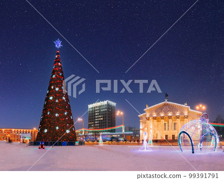 Gomel, Belarus. Amazing Bright Starry Sky Above Xmas Christmas Tree In Lenin Square And Drama Theatre With Christmas New Year Decorations In Evening Night Illumination. Evening View Of City Center Gomel, Belarus. Amazing Bright Starry Sky Above Xmas Christmas Tree In Lenin Square And Drama Theatre With Christmas New Year Decorations In Evening Night Illumination. Evening View Of City Center 99391791