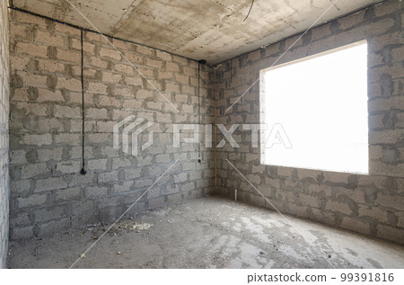 Construction of an individual residential building, view of two walls, blind interior and exterior with a window opening Construction of an individual residential building, view of two walls, blind interior and exterior with a window opening 99391816