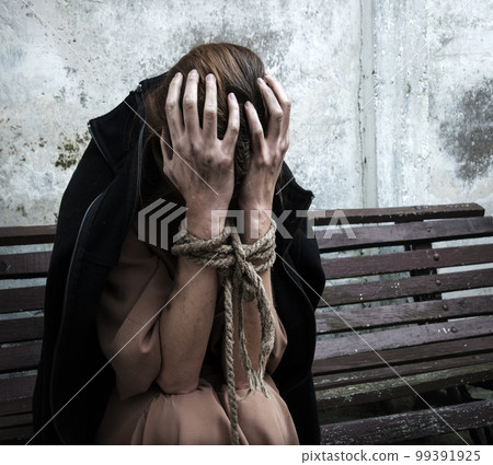 The bound prisoner sit on the bench The bound prisoner sit on the bench 99391925