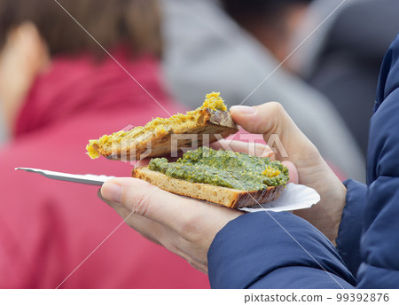 Purchase of refreshments at the Prague street market. 99392876