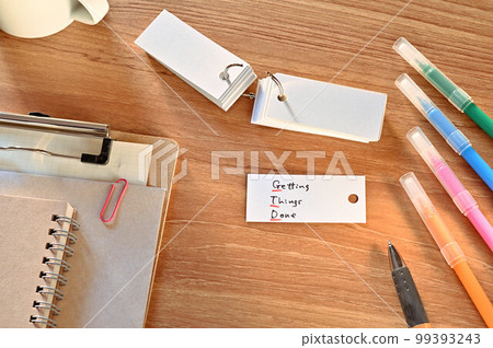 A desk with a flashcard that says Getting Things Done A desk with a flashcard that says Getting Things Done 99393243