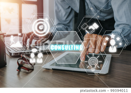 Consulting business concept, Businessman using digital tablet on office desk with consulting icon on virtual screen, Investment Consultant,Financial Consultant. Consulting business concept, Businessman using digital tablet on office desk with consulting icon on virtual screen, Investment Consultant,Financial Consultant. 99394011