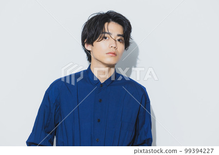 A man in a navy shirt 99394227