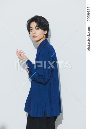 A man in a navy shirt A man in a navy shirt 99394234