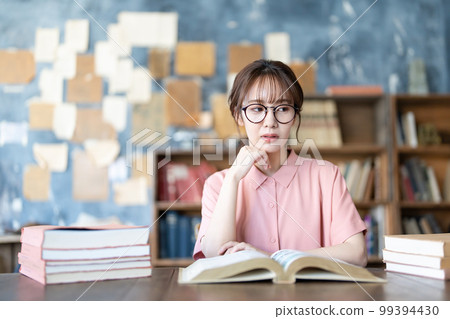 A young woman reading A young woman reading 99394430