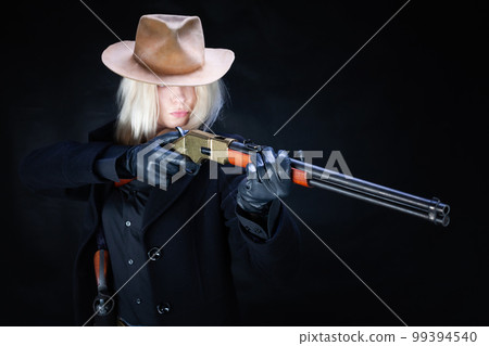 Old west girl in white hat with rifle 99394540