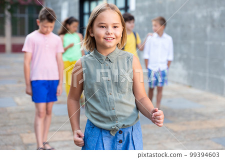 Girl walking outdoors 99394603