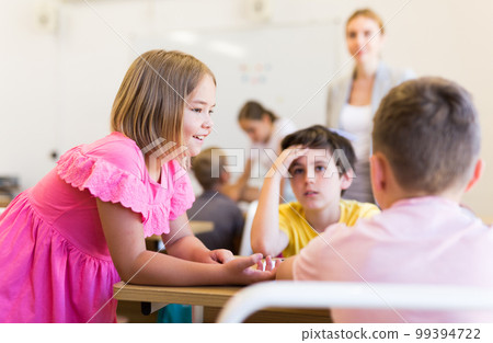 Children performing group tasks 99394722