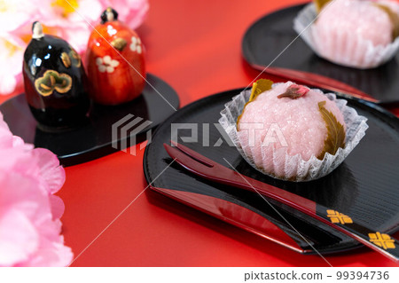 Japanese Spring Sweets Sakura Mochi and Hina Dolls 99394736