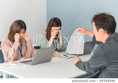 A business woman who is scolded by her boss/customer at a company/office (stress, trouble, quota, power harassment) 99394946