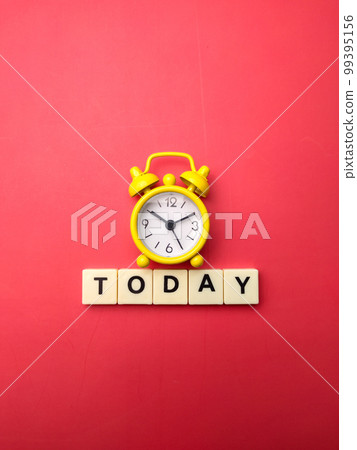 Yellow alarm clock with the word TODAY on a red background. Yellow alarm clock with the word TODAY on a red background. 99395156