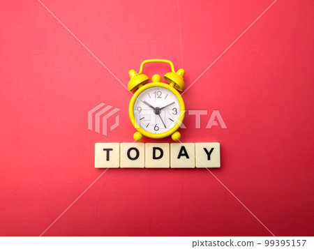 Yellow alarm clock with the word TODAY on a red background. Yellow alarm clock with the word TODAY on a red background. 99395157
