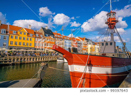 Copenhagen city skyline in Denmark at famous old Nyhavn port 99397643