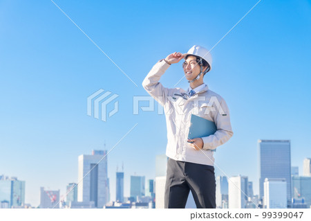 Young male engineer in helmet 99399047