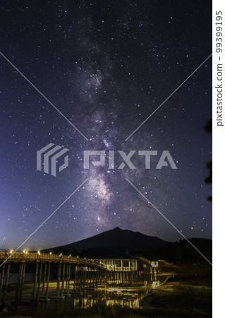 Aomori Prefecture Tsurunomai Bridge and the Milky Way over Mt. Iwaki 99399195