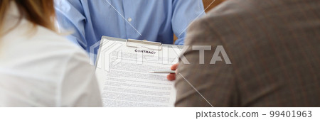 Married couple signs contract to buy house from male realtor or broker 99401963