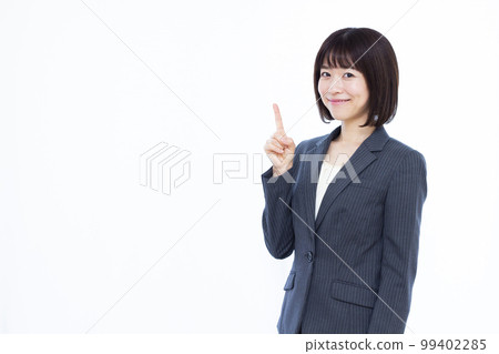 A business woman in her thirties who is introducing 99402285