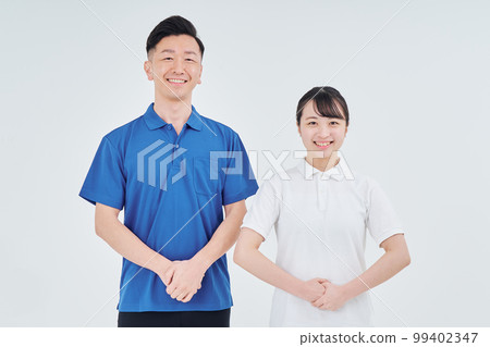 Men and women of contractor staff wearing polo shirts 99402347
