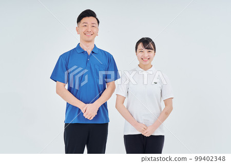 Men and women of contractor staff wearing polo shirts 99402348