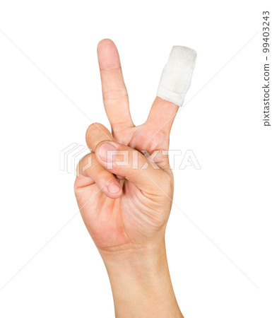 Hand showing the sign of victory with bandage isolated Hand showing the sign of victory with bandage isolated 99403243