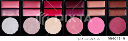 Multi-colored eye shadow palette top view. Abstract background of eye shadows. Multi-colored eye shadow palette top view. Abstract background of eye shadows. 99404149