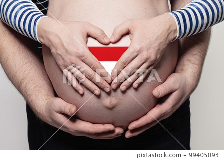 New belarusian family concept. Man embracing pregnant woman belly and heart 99405093