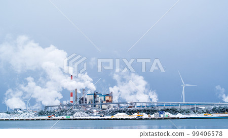 Winter factories and wind power generators with smoke billowing Akita Port Winter factories and wind power generators with smoke billowing Akita Port 99406578