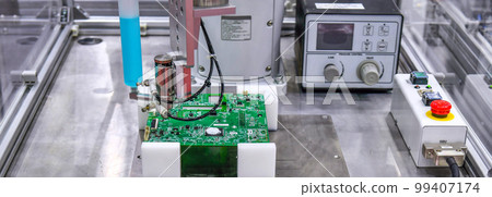 Technological process of soldering and assembly chip components on pcb board. Automated soldering machine inside at industrial 99407174