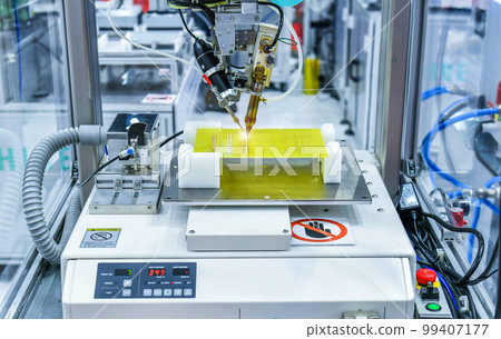 Technological process of soldering and assembly chip components on pcb board. Automated soldering machine inside at industrial Technological process of soldering and assembly chip components on pcb board. Automated soldering machine inside at industrial 99407177