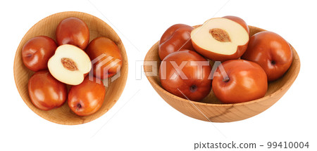 jujube or chinese date in wooden bowl isolated on white background . Top view. Flat lay 99410004